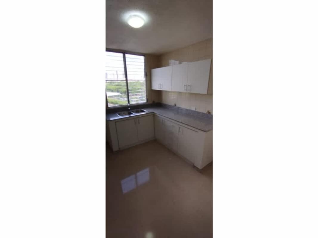 Bright living dining area with ceramic tile and balcony access in PH Altos del Golf Via Porras Panama