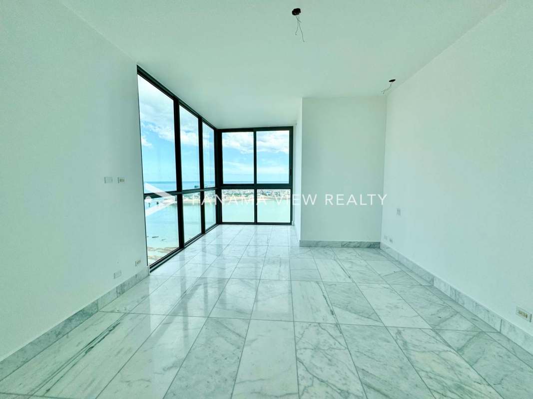 Bright bedroom with marble floors and ocean view at Sea Point in Punta Paitilla