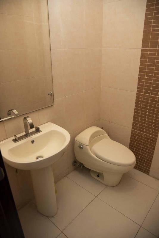 Bathroom with granite countertop sink and glass shower enclosure PH The Cosmopolitan Panama
