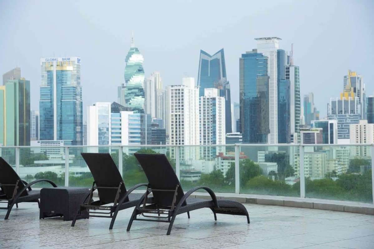 Furnished bedroom with large window and walk-in closet PH The Cosmopolitan Panama