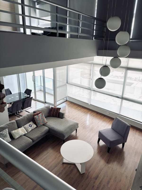 Private balcony with seating area overlooking Panama Bay at PH Bayfront