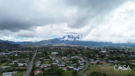 Fruit trees and garden area at mountain view house backyard Nueva California Volcán