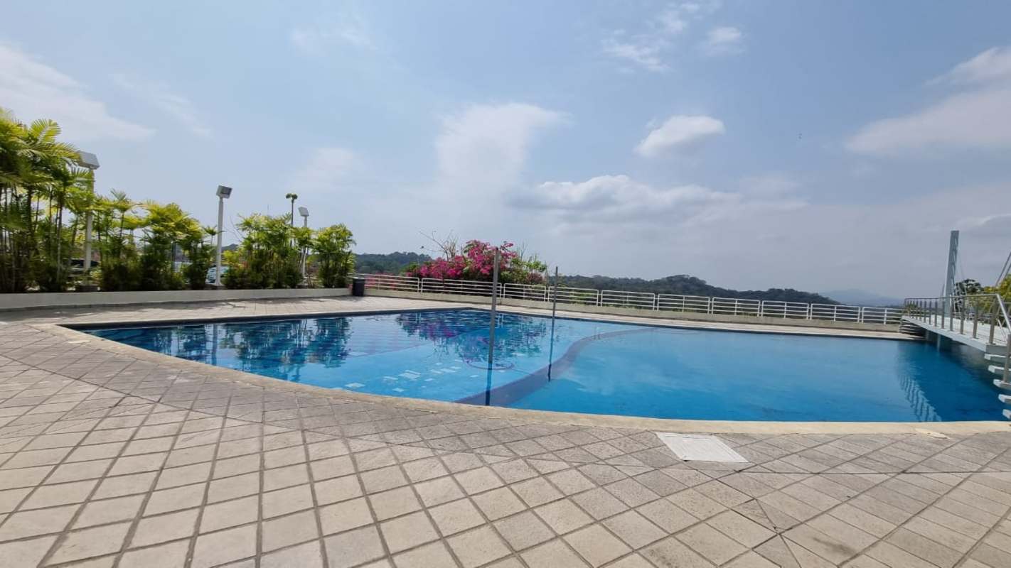 Large outdoor pool surrounded by gardens and apartments in PH Altamira Gardens Panama