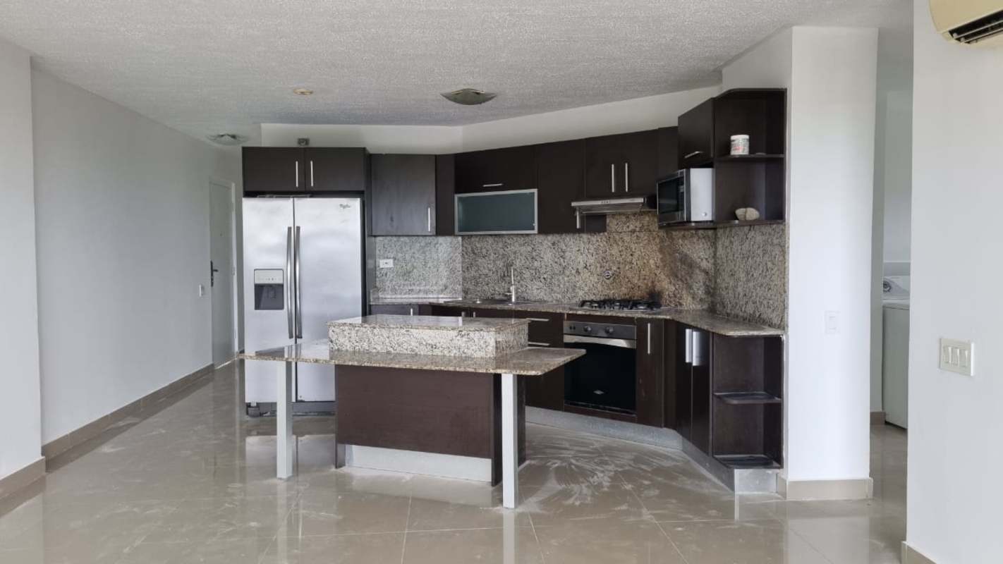 Bright kitchen with granite counters, island, stainless appliances in Altamira Gardens Altos de Panamá Panama City