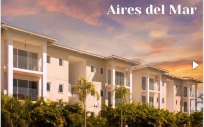 Modern living dining space with large sliding glass doors ocean view Panama beachfront condo