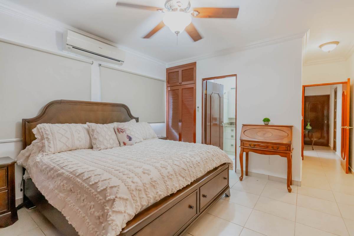 Spacious primary bedroom with ensuite bathroom in La Loma residential house