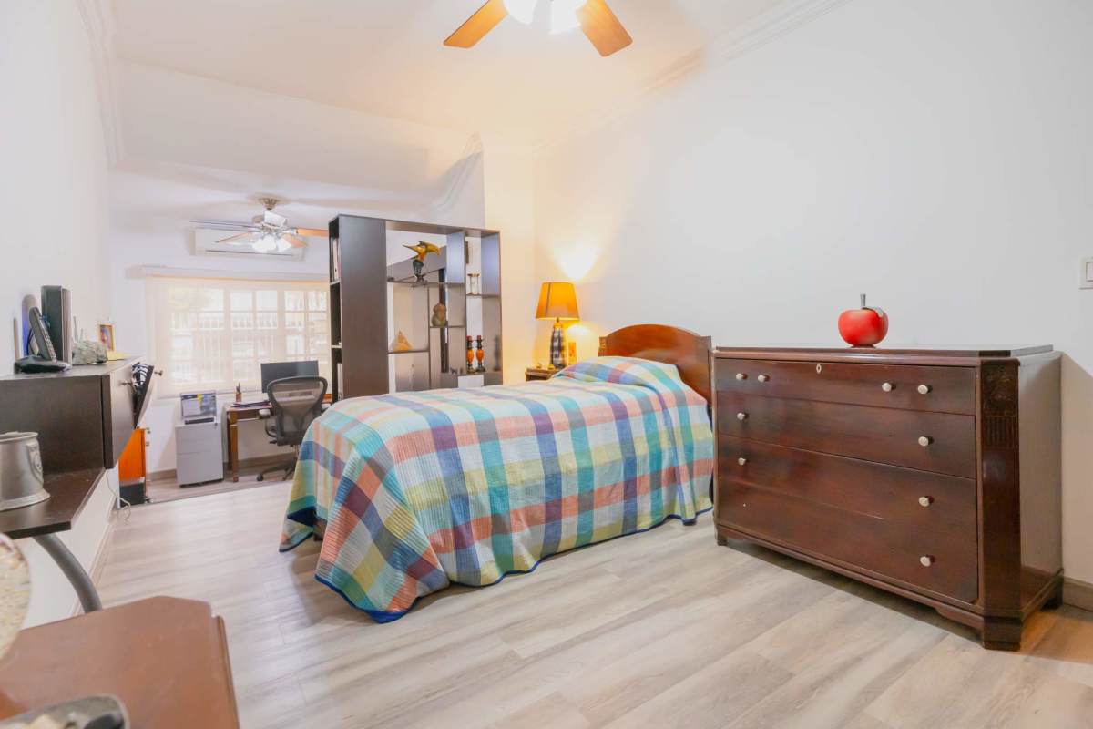 Covered terrace facing private pool with lush tropical landscaping La Loma house