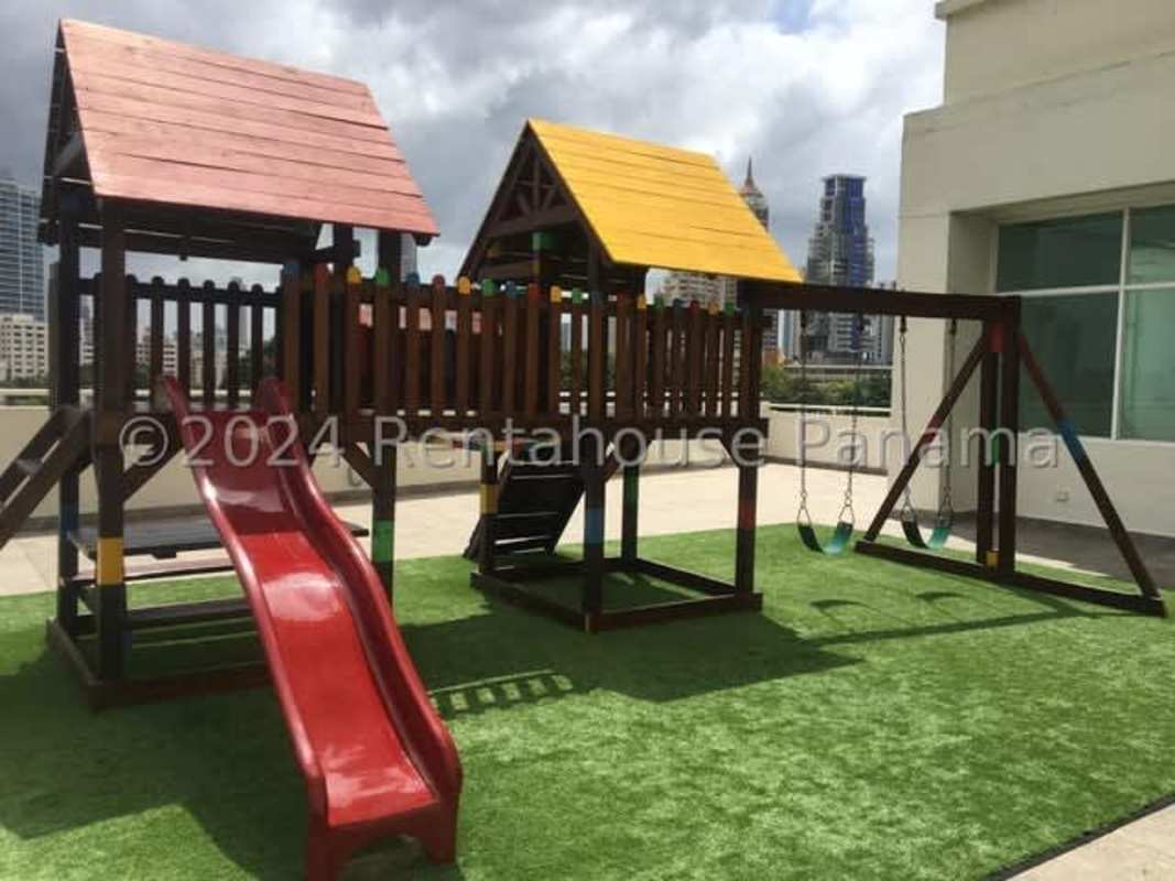 Living space with tiled floor and view to open kitchen at PH Vivendi Towers Panama City