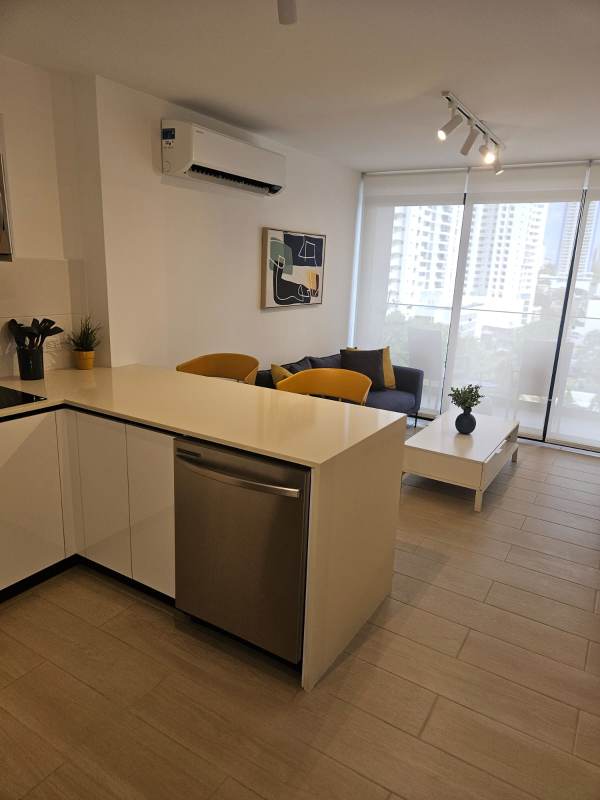 Infinity pool with sun deck overlooking city skyline at PH Living 73 San Francisco Panama