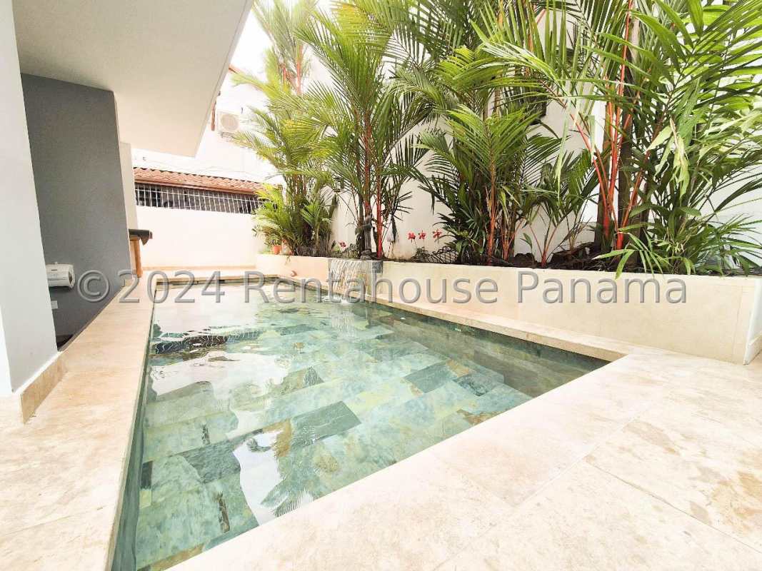 Modern small pool surrounded by garden planters townhome Altos del Golf Panama