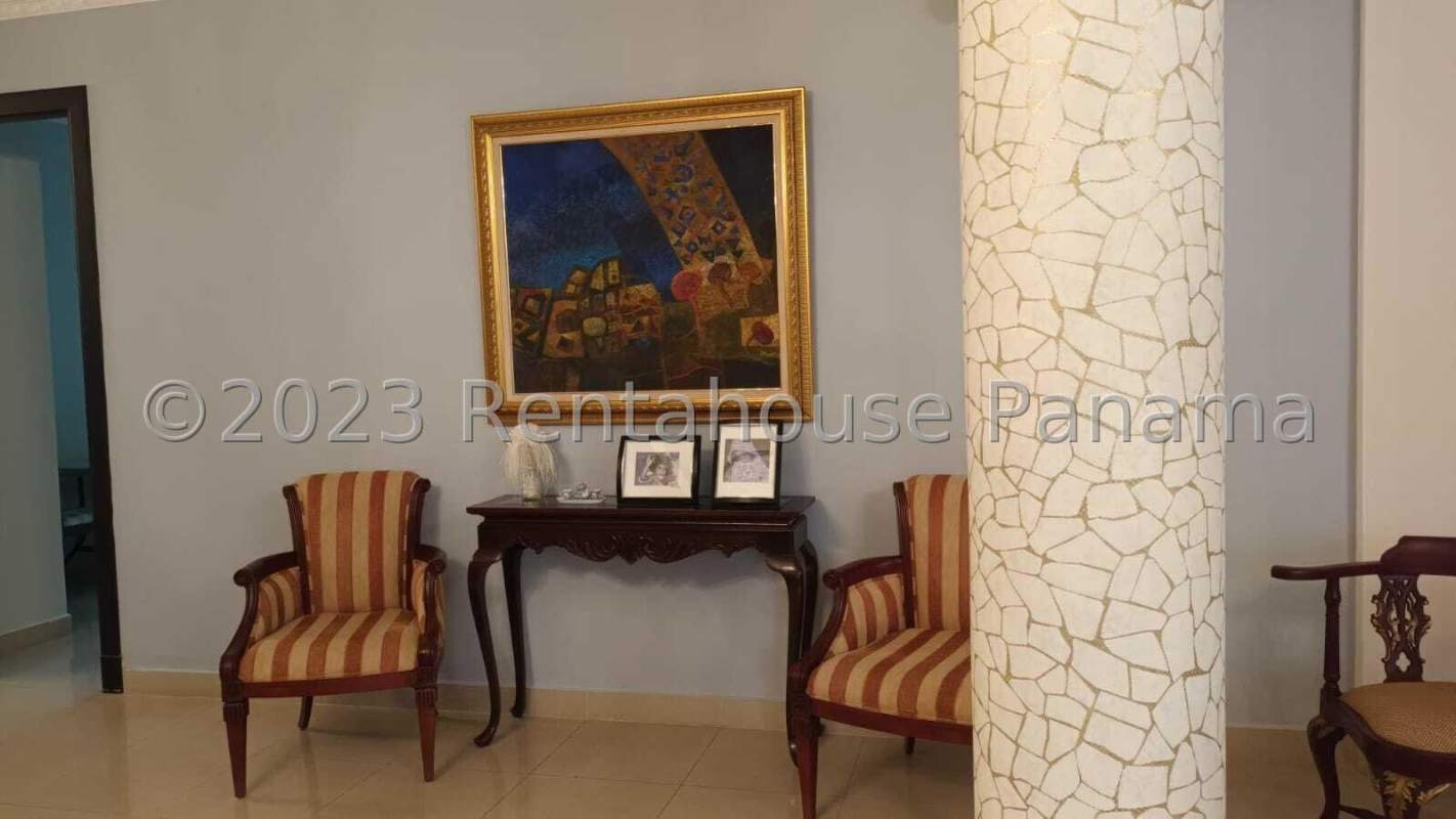 Formal dining room with chandelier and large wood table in luxury house Altos de Panamá Panama