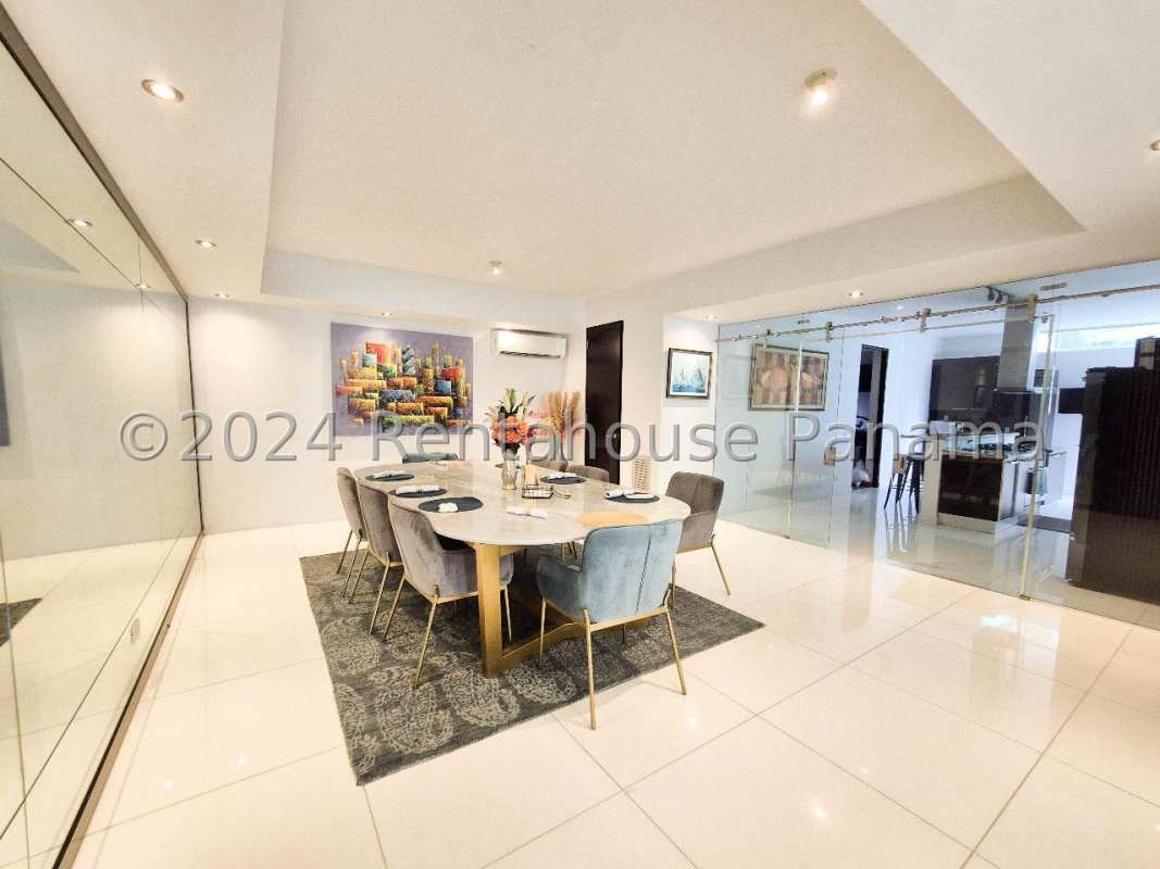 Spacious foyer entrance with glass railing stairs and modern lighting Altos del Golf Panama