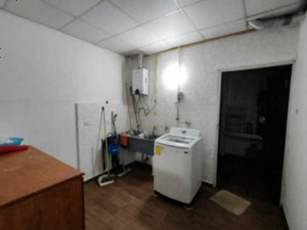 Bright living dining area with wood floors and ceiling fans in El Romeral Chanis Panama City