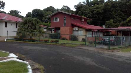 Minimalist empty room with wood-look tile floors neutral walls in Howard home Panama Pacifico