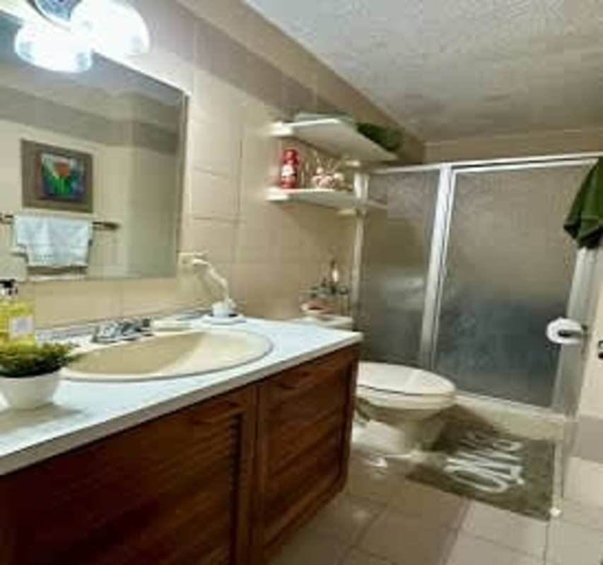 Living and dining room with ocean and skyline panorama PH BICSA Tower