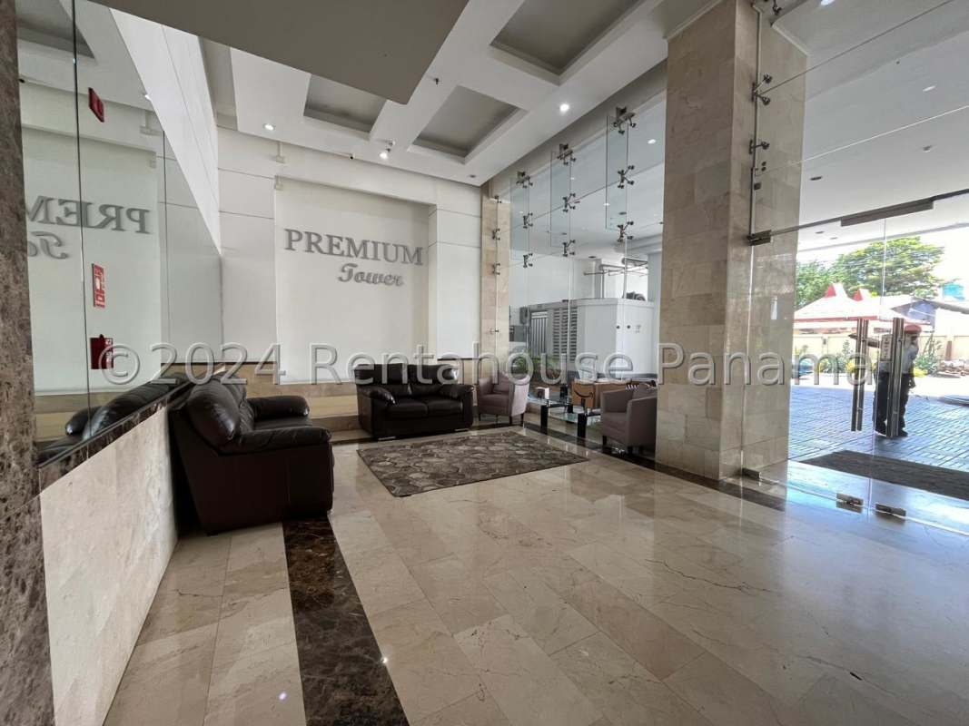 Elegant residential lobby with marble flooring and seating area at PH Premium Tower San Francisco Panama City