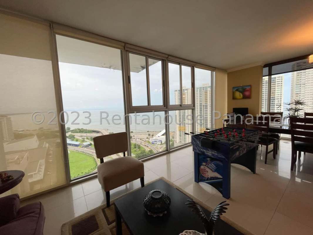 Bedroom with large window and city skyline view at PH San Francisco Bay Panama City