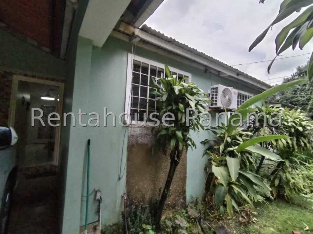 Large covered terrace overlooking lush backyard Villa Zaita Panama house for sale