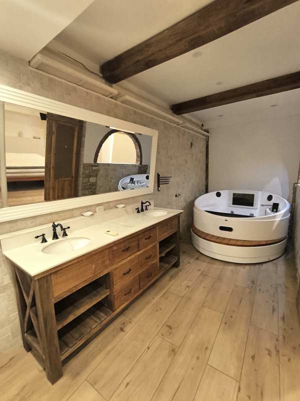 Bedroom with wood floor, balcony, ocean and canal views at Amador Causeway Panama