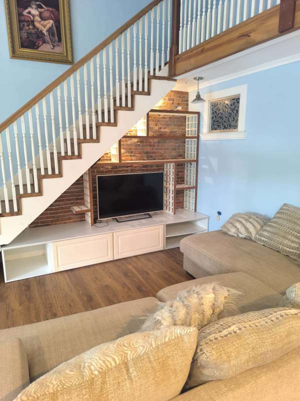 Kitchen with granite countertops, white cabinets at Amador Causeway apartment Panama City