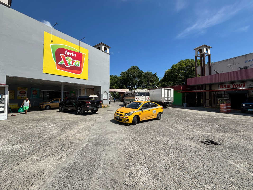 Retail shopping center with large parking lot next to Xtra supermarket in Las Mañanitas Panama
