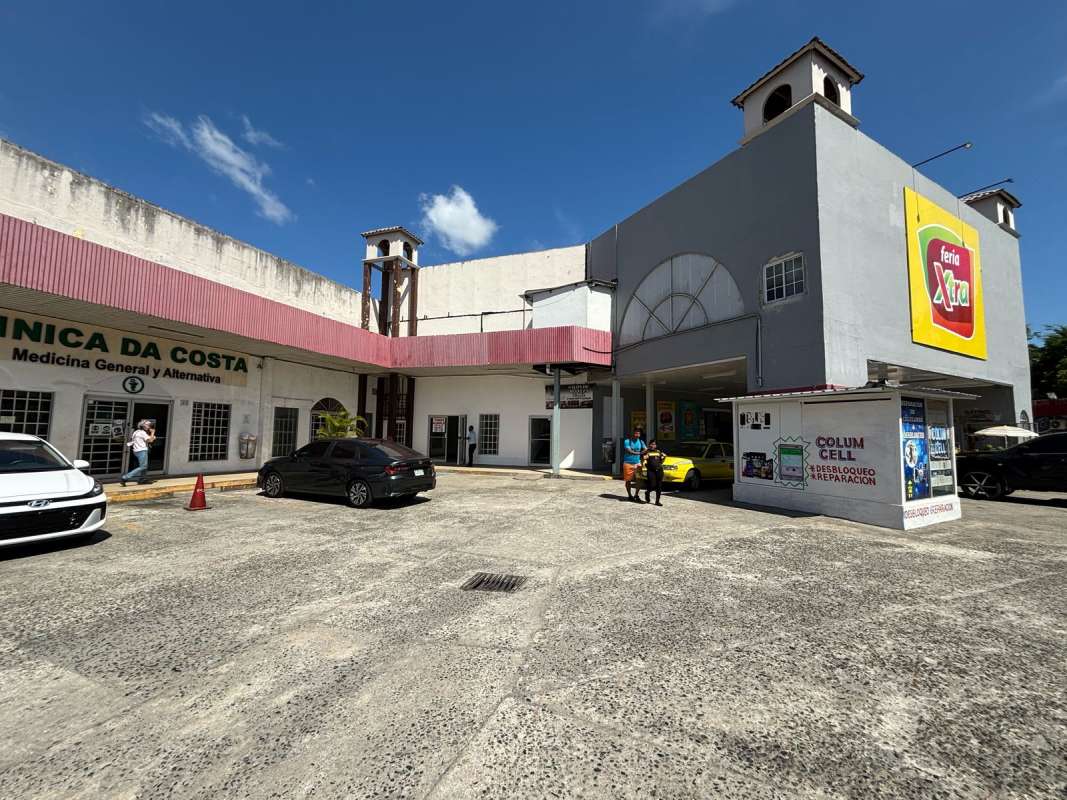 Exterior view of Las Mañanitas retail plaza with marquee signage ample parking and nearby shops