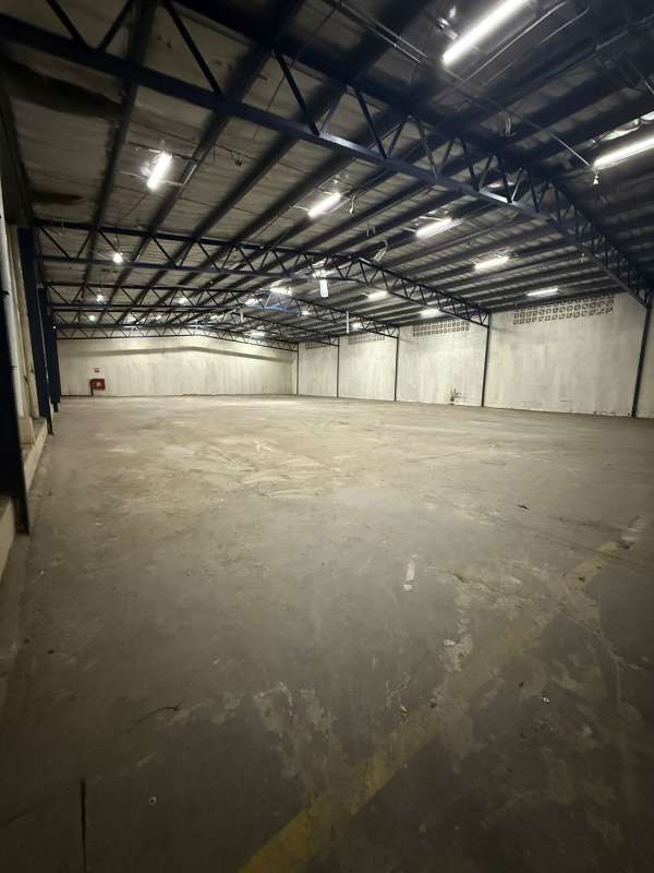 Warehouse interior with finished office area and concrete floor in Panama City