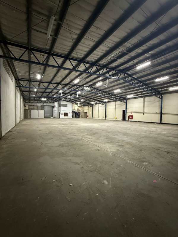 Interior spacious empty industrial warehouse high metal roof Panama