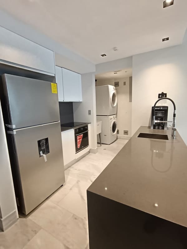 Modern furnished living room with sea view balcony in Nuovo by Armani Casa Panama