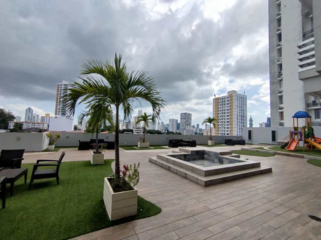 Rooftop terrace with seating, children's playground and skyline views in Vista Hermosa Tower Carrasquilla Panama