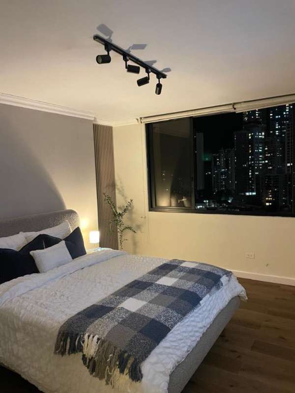 Open-concept dining area with large windows and skyline views PH Arrecife Punta Paitilla Panama