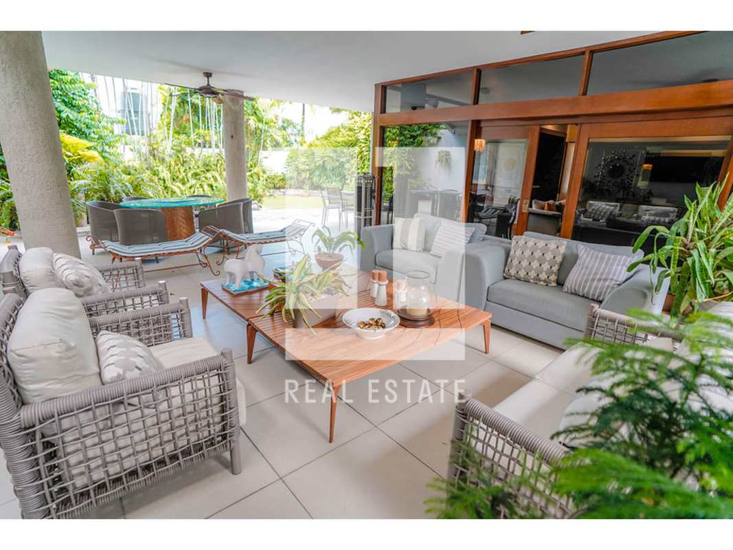Modern living room with hardwood, large windows, elegant furnishings in luxury house Altos del Golf Panama