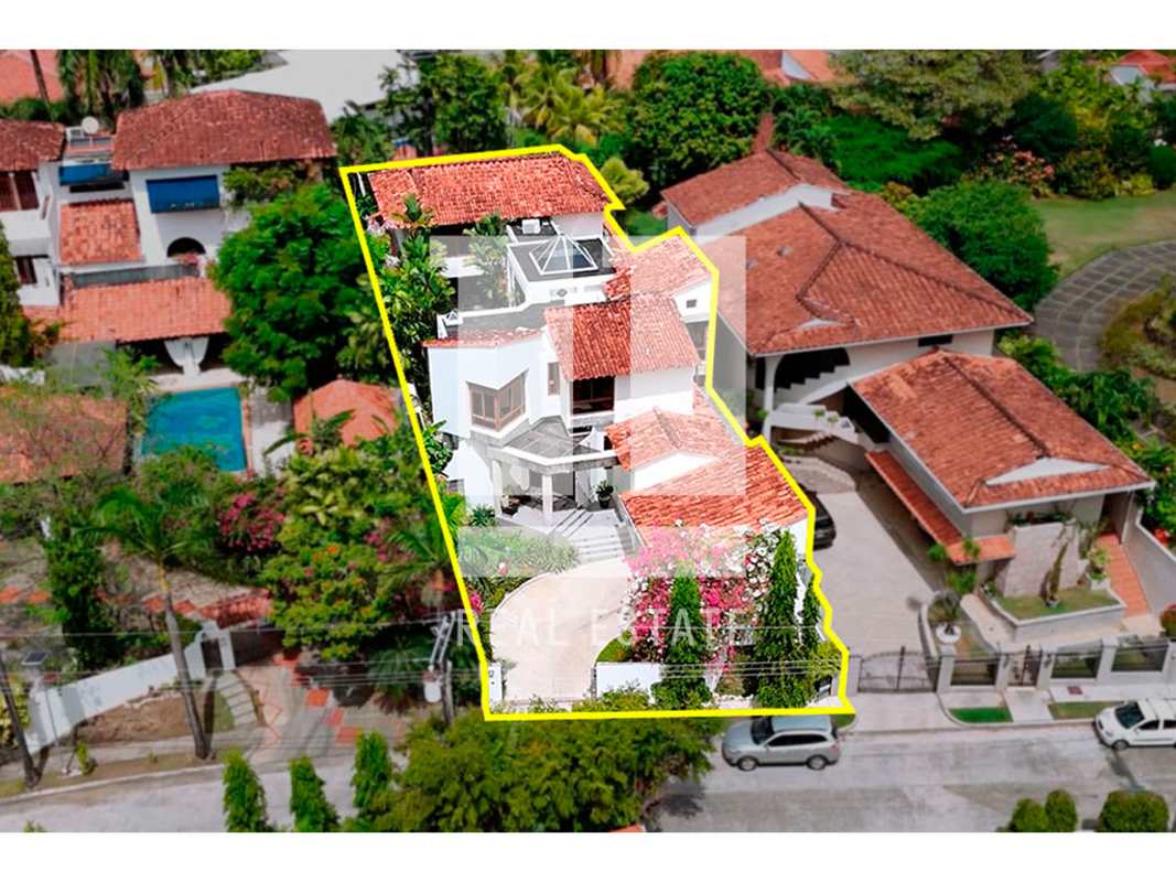 Aerial view luxury Mediterranean-style house red tile roof surrounded by greenery Altos del Golf Panama City