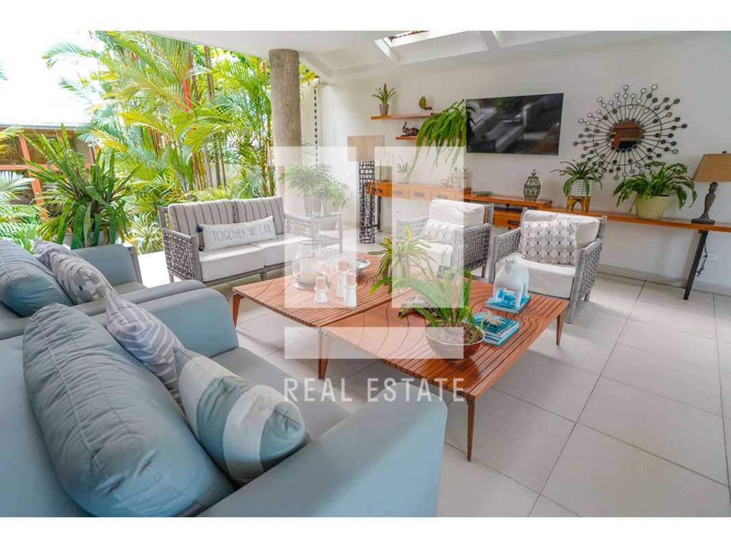 Covered patio with tropical garden views luxury house for sale Altos del Golf Panama City