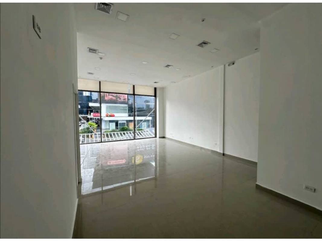 Spacious commercial interior with large glass windows and gray tiled floors in Plaza Vía Brasil San Francisco Panama