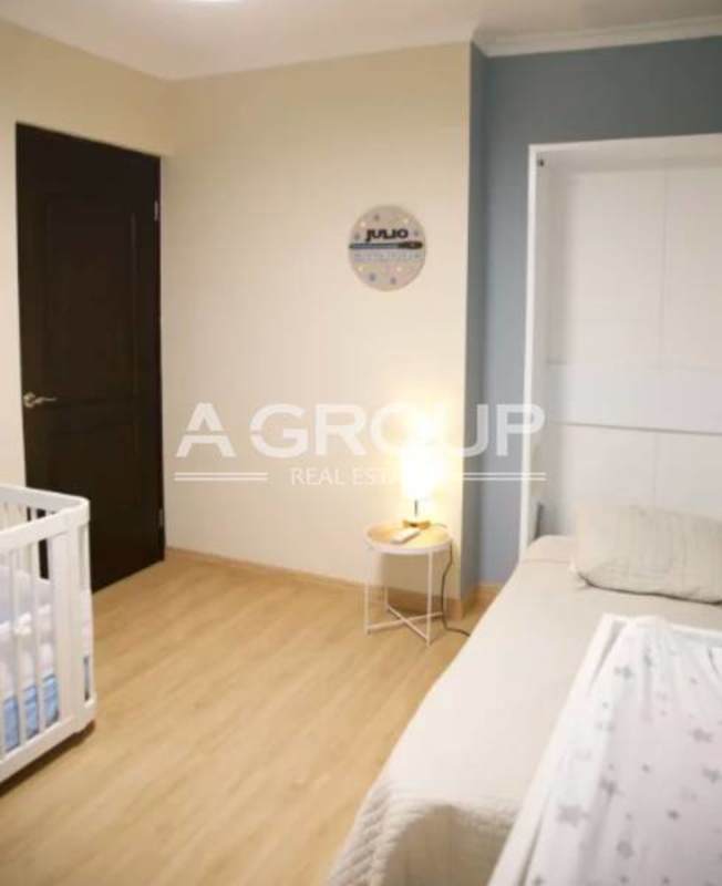 Kitchen featuring granite counters, steel fridge, wooden cabinets PH Pacific Sun Panama