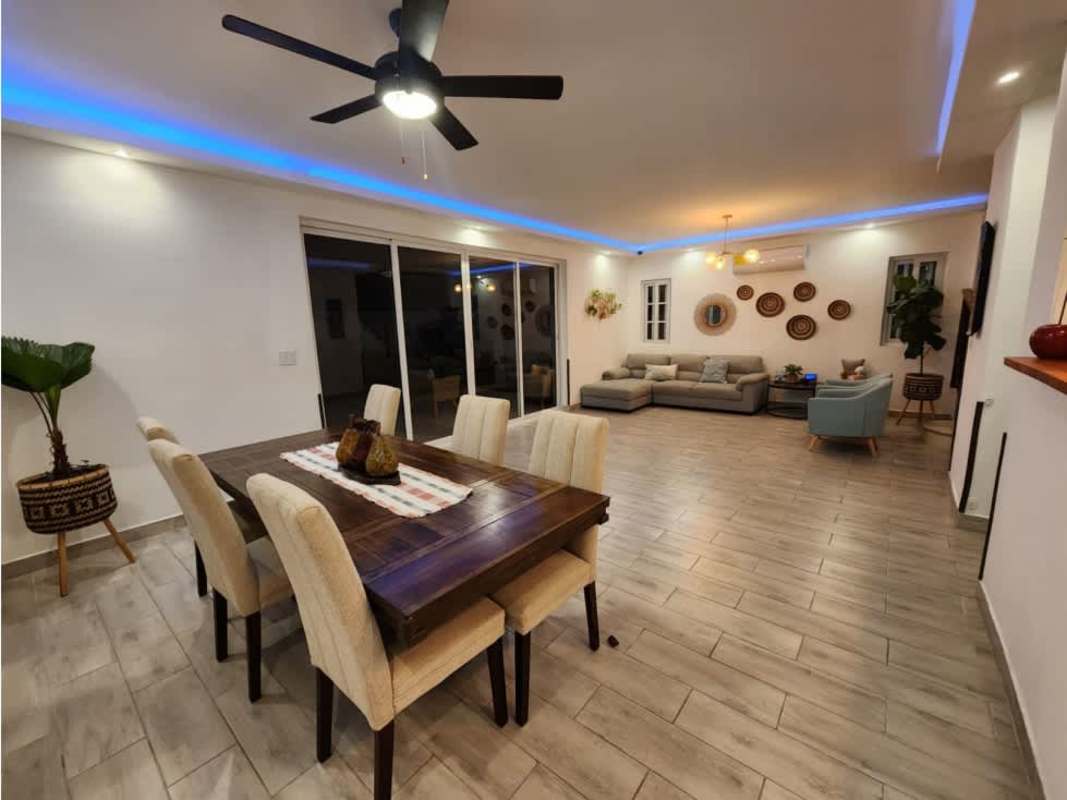 Spacious open plan living dining room with modern tile flooring in PH Villa Valencia Costa Sur Panama