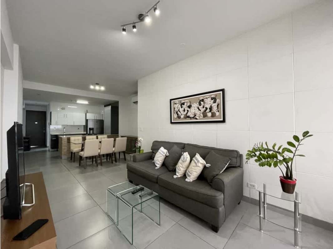 Remodeled kitchen with granite countertop and built-in appliances in PH Element Panama City apartment