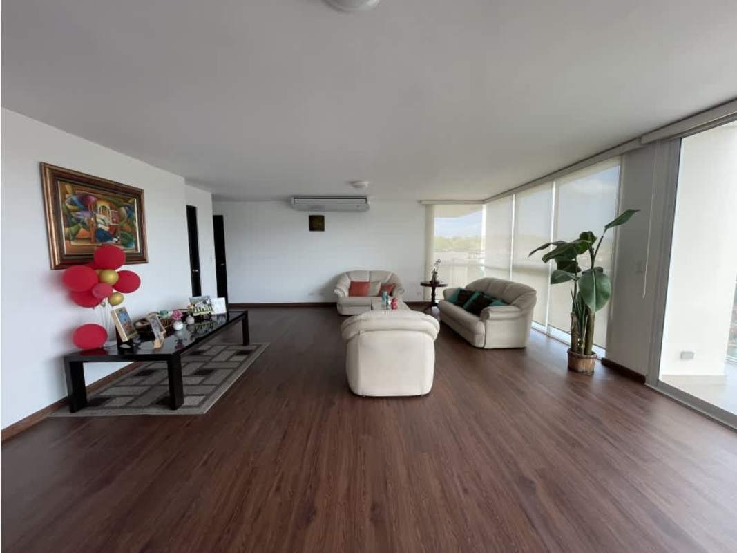 Living room with floor-to-ceiling windows in PH Pine Hills Clayton penthouse