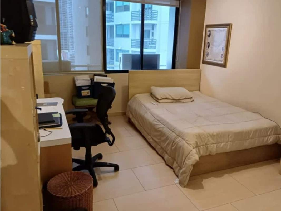 Bedroom with workspace, large window, neutral decor in PH Royal Princess Punta Paitilla Panama