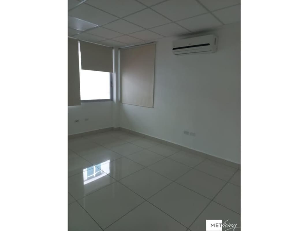 Office area with glass doors, green wall décor, tiled floor in PH El Cangrejo Plaza