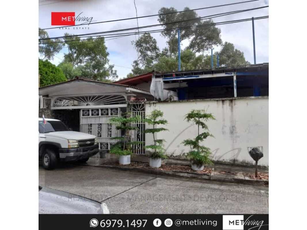 Minimalist living room with tiled flooring, arched doorway, white walls in Villa Lucre Panama City