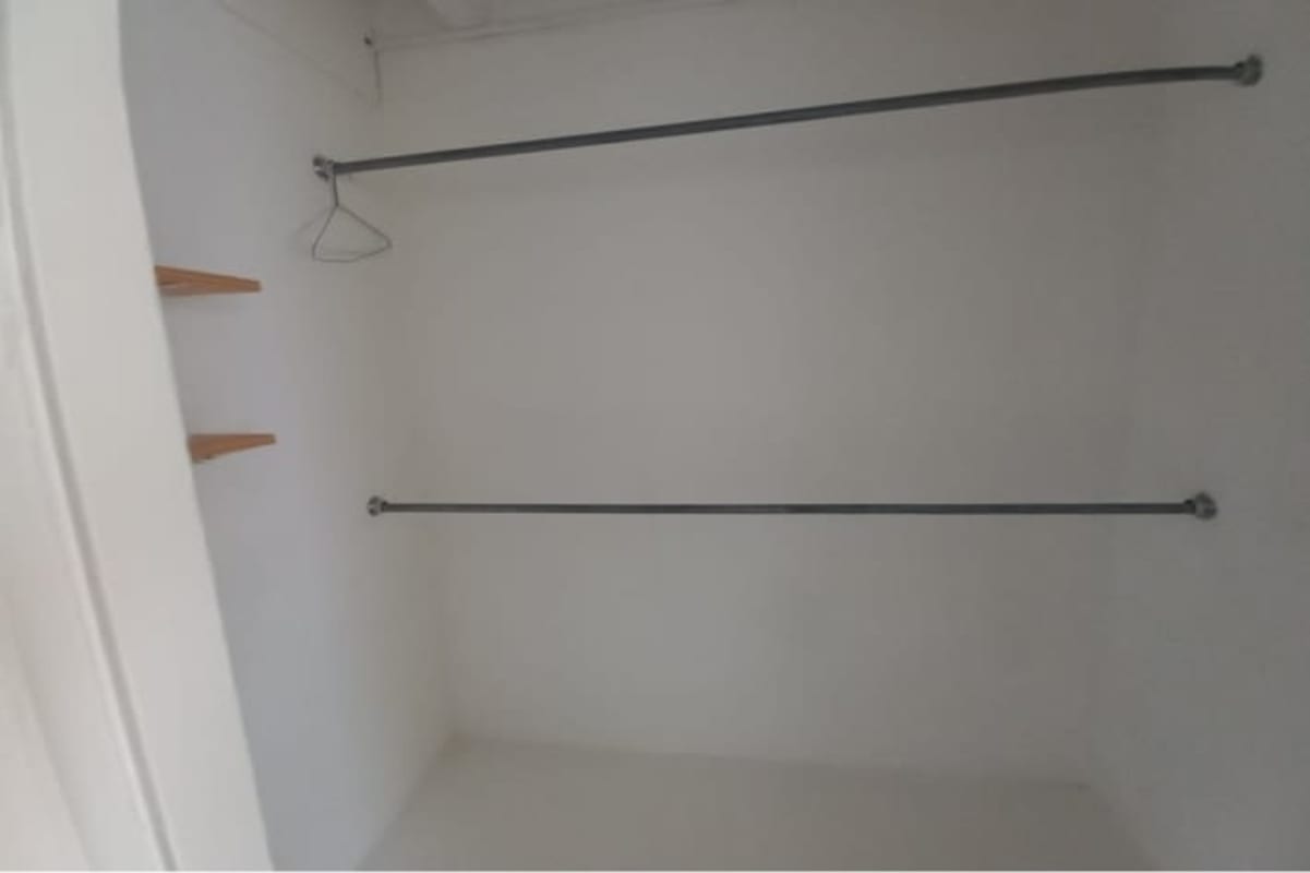 Minimalist closet with shelves and hanging space apartment for rent Calidonia Panama