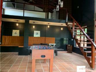 Loft recreation room foosball built-in seating staircase rustic modern Cerro Azul