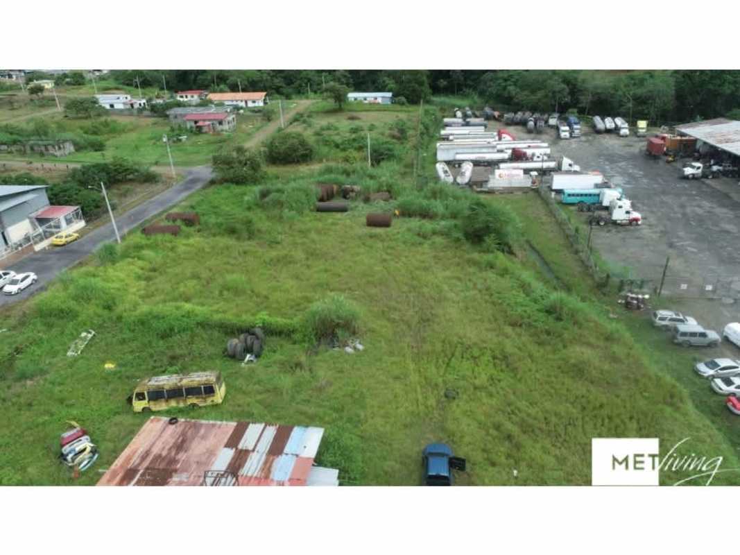 Vacant grassy industrial lot near truck yard, residential neighborhood and highway Chepo Panama
