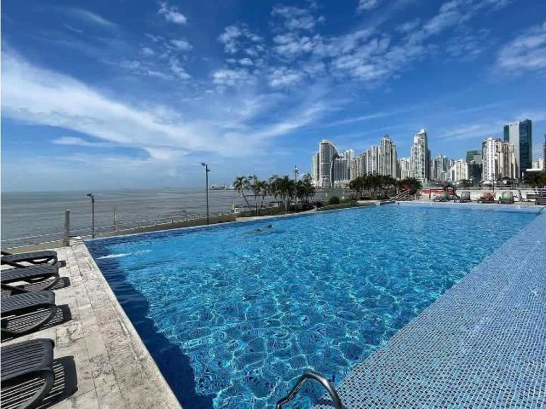 Outdoor children's playground area with city skyline backdrop at PH Terrawind Coco del Mar Panama