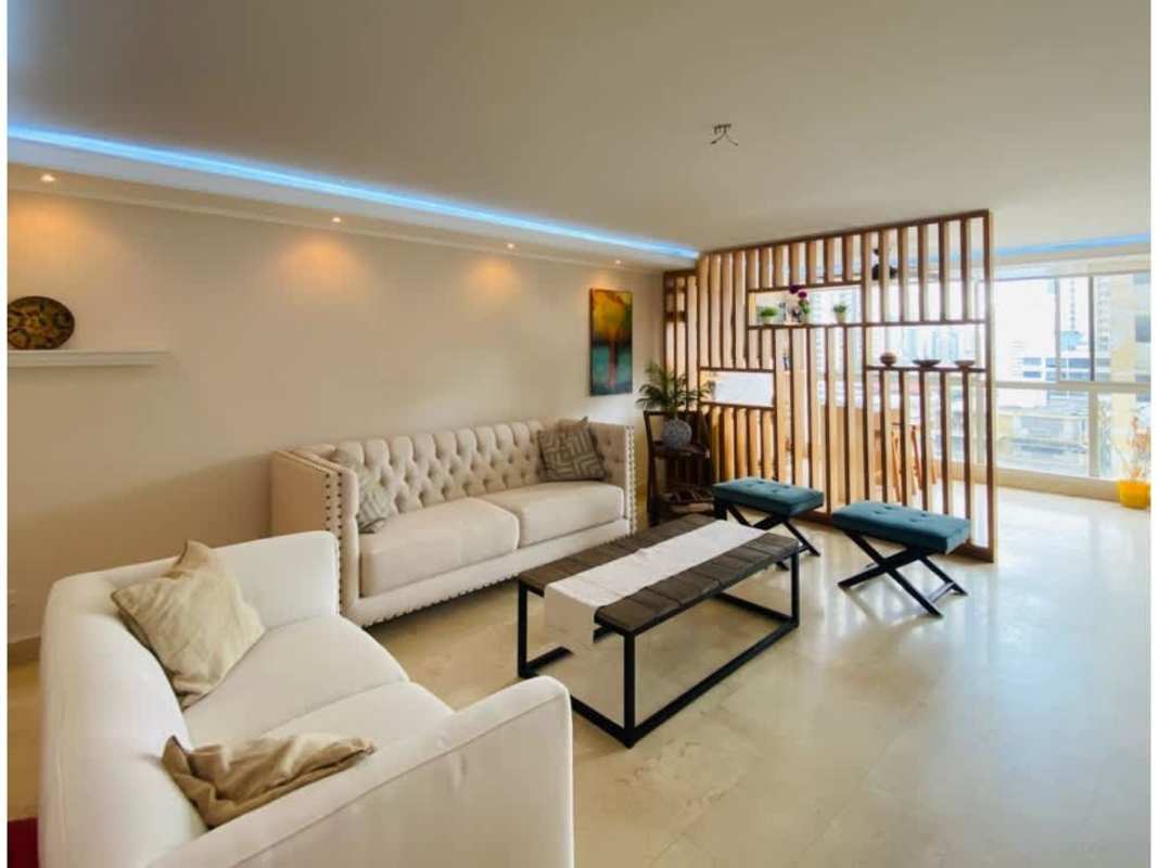 Bright living room with large windows, LED lighting, and modern furnishings at PH Terrazas del Cangrejo Panama City