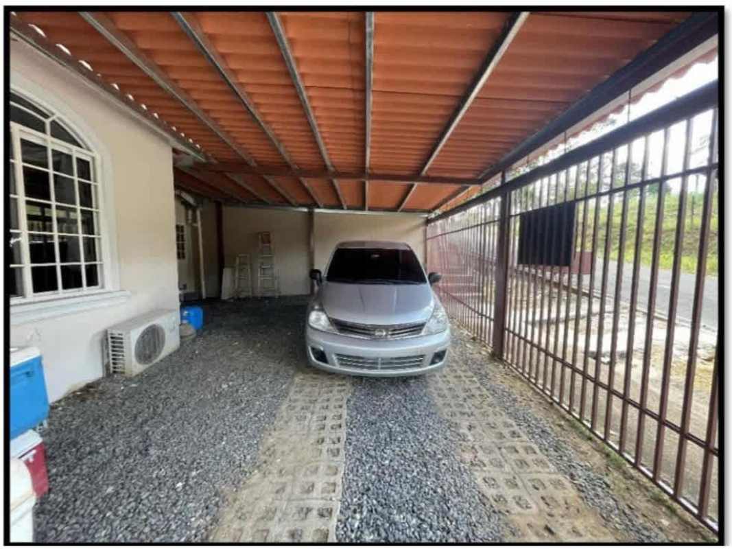 Outdoor BBQ area with garden and brick grill in Villa Zaita Panama house