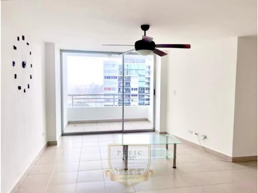 Open plan living dining space with balcony doors and natural light at Central Park Towers Panama