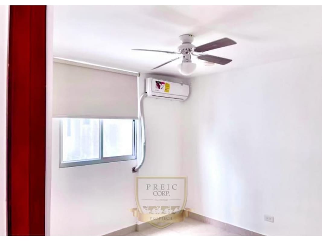 Minimalist bedroom with tile floor, roller shade, air conditioning and ceiling fan at Central Park Towers Panama